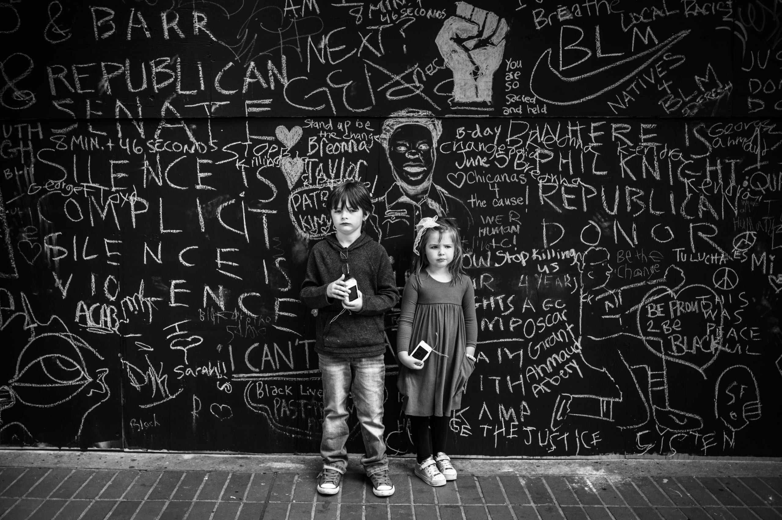 Kids in front of graffiti wall'