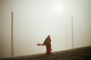 woman dancing by foggy river