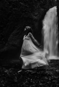 woman by waterfall