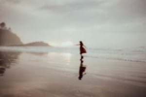 Blurry image of girl on the beach