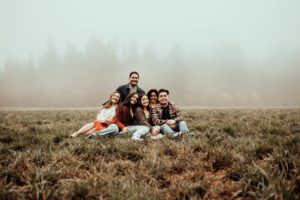 Family of six in a foggy field