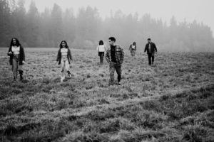 Family in a field in fog