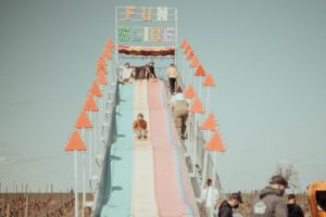 Kids on amusement park slide
