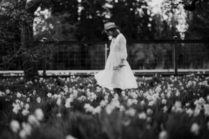 Woman in daffodil field in black and white