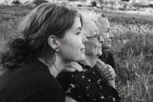 Black and white profile portrait of daughter, mom and grandmother