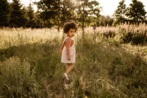 Little girl in a field of flowers